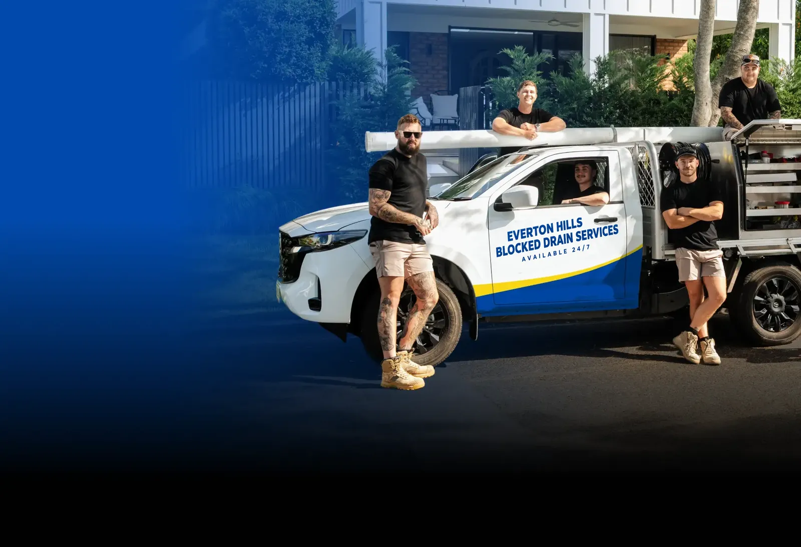 Everton Hills Blocked Drain Services team with the ute